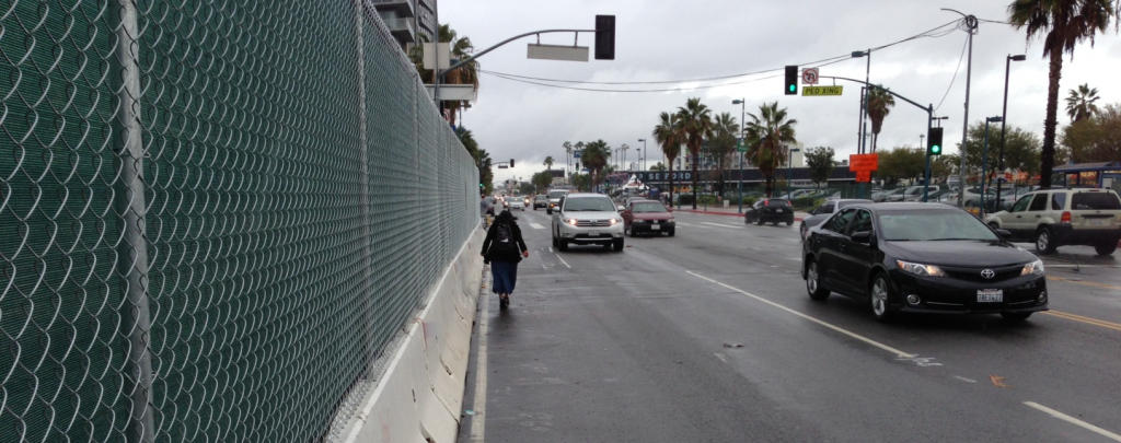 With the sidewalk closed, this pedestrian chose to walk in the street rather than cross to the other side of Lankershim.
