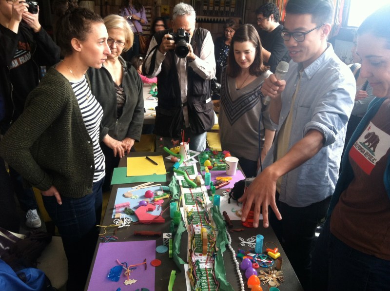 Bruce Chan, second to the right, explains his group's model of Glendale Boulevard as a culturally rich roadway. Photo: Kris Fortin