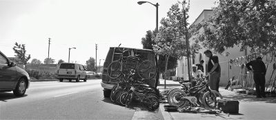 A vendor sells salvaged bikes along Manchester Avenue. Under the ordinance proposed by councilmember Joe Buscaino, this kind of activity would be criminalized. Sahra Sulaiman/Streetsblog L.A.