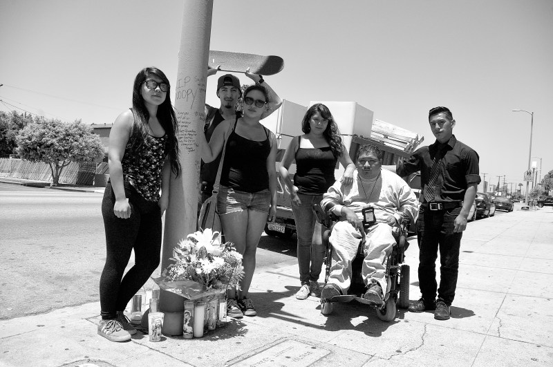 Friends of Oscar Toledo, Jr., gather to mourn at the site where he was killed by a hit-and-run driver near 47th and Normandie in South L.A. Sahra Sulaiman/Streetsblog LA