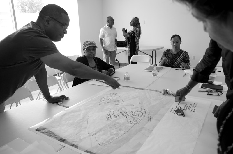 Stakeholders discuss what they would like to see replace the parking lots and warehouses in the Village area. Sahra Sulaiman/Streetsblog L.A.