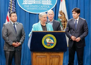 Senator Fran Pavley (D-Agoura Hills) addresses the media after the passage of S.B. 32 in August. She's flanked by Assemblymember Eduardo Garcia (D-Coachella), Governor Jerry Brown, and Senate President Pro Tem Kevin De Leon, from left. Image courtesy Fran Pavley's office.