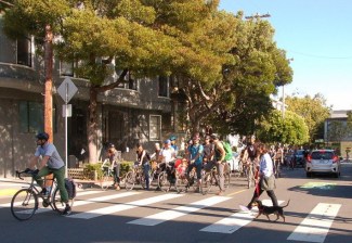 Bicyclists in San Francisco showed what happens if they follow the letter of the law at stop signs. Photo by Aaron Bialick
