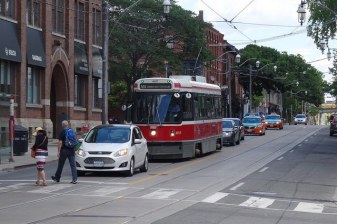 Currently, streetcars get bogged down down in private car traffic on King Street, Toronto's busiest surface transit route. A new plan would divert private vehicles out of the path of transit. Photo: booledozer/Flickr