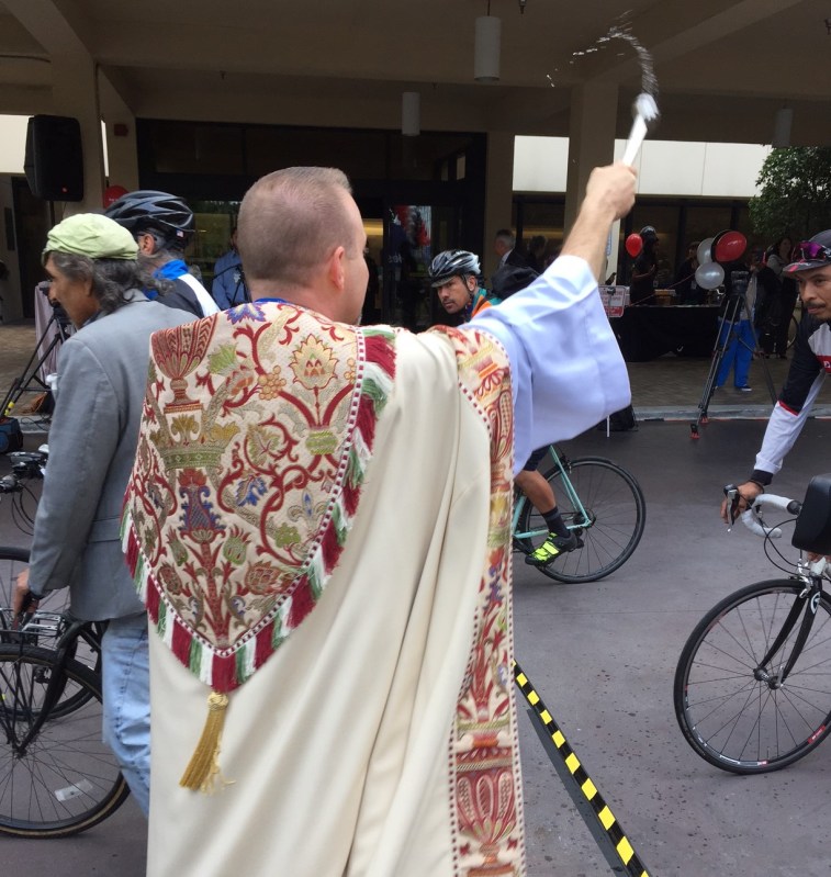 Priest blesses cyclists with holy water at Good Samaritan Hospital's 2017 Blessing of the Bicycles. Photos by Joe Linton/Streetsblog L.A.