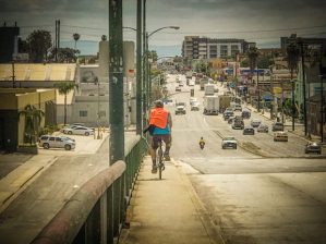 A man bikes east on Anaheim St. above the 710. Photos by Brian Addison.