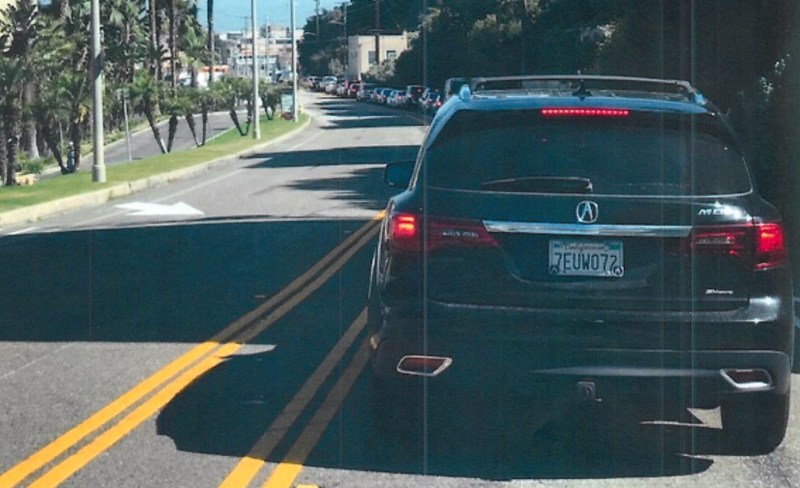 The lawsuit exhibits include plenty of shots like this of cars backed up on PDR streets. Image via KLM lawsuit