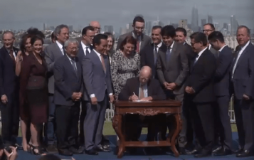 Governor Brown signs a package bills legislators hope will begin to solve the housing crisis. Image: LiveStream