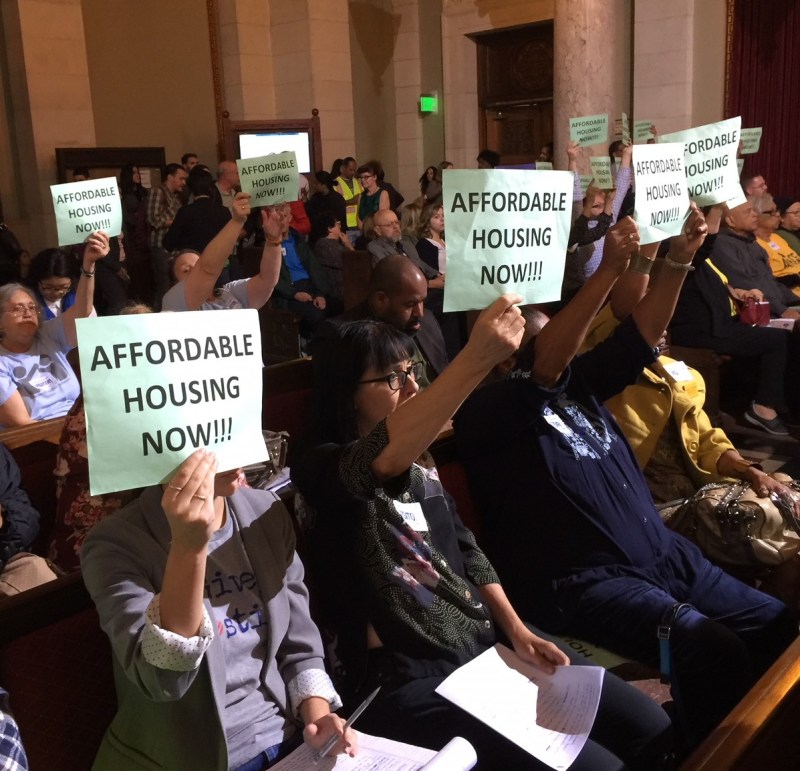 Linkage Fee supporters holding up AFFORDABLE HOUSING NOW signage in council chambers today. Photo by Joe Linton/Streetsblog L.A.