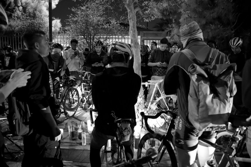 Friends of Frederick "Woon" Frazier and fellow cyclists gather around the ghost bike placed near the site where he was run down just a few days prior. Sahra Sulaiman/Streetsblog L.A.