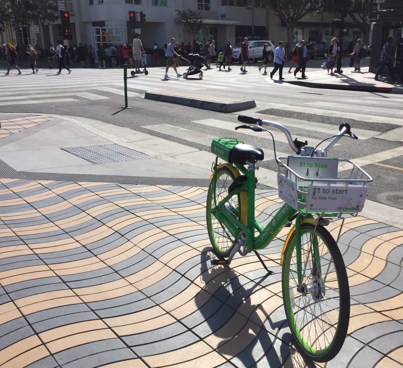 L.A. City approved new requlations for e-scooters, e-bikes, and dockless bike-share. Lime e-bike and Bird e-scooter in Santa Monica picutured. Photo by Joe Linton/Streetsblog L.A.