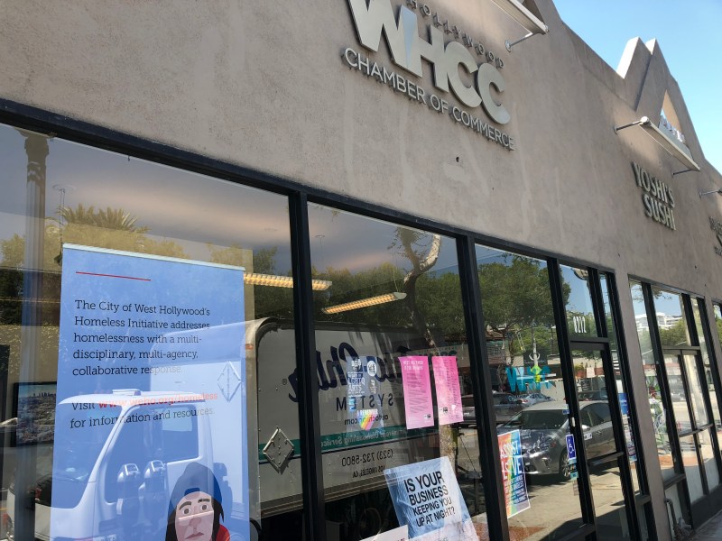 The West Hollywood Chamber of Commerce's offices include a message for the city's homeless that there is help available should they choose it. Photo: Damien Newton