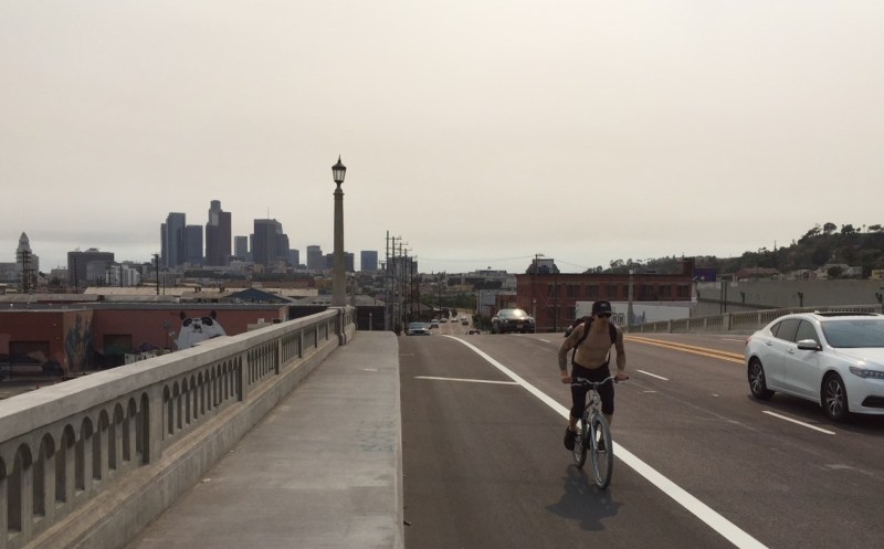 Cyclist on the North Spring Street Viaduct's striped-off area where bike lanes should have been. Photo by Joe Linton/Streetsblog L.A.