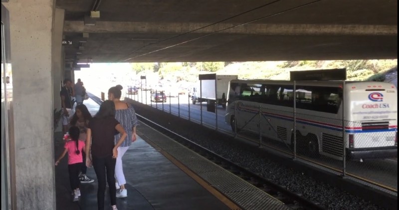 Family on the Vermont Avenue Green Line Station platform. Capture via Streetfilm