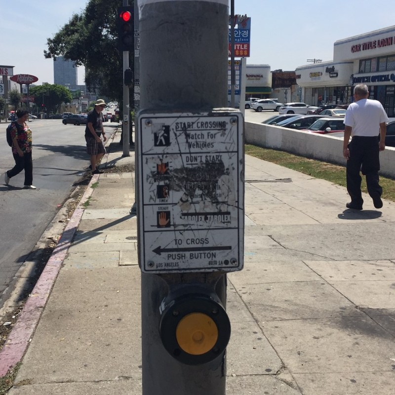Pedestrian beg buttons are designed to speed up driving and to make people walking wait longer. Photo: Joe Linton/Streetsblog L.A.