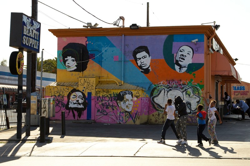 Angela Davis, Muhammad Ali, Martin Luther King, Jr., César Chávez, and, somewhat incongruously, Salvador Dalí grace a wall near Manchester and Hoover in South Central, Los Angeles. Sahra Sulaiman/Streetsblog L.A.