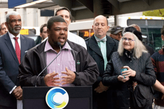 Cam Hardy, the volunteer advocate who led the fight for Cincinnati's first dedicated bus lane, speaks at there ribbon cutting ceremony this morning. Photo: City of Cincinnati