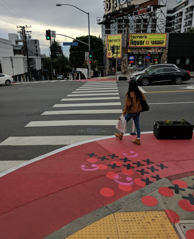 Painted curb extension at Sunset and Larrabee with decorative elements by street artist The Art of Chase. All photos by Scott Epstein