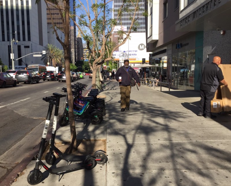 E-scooters parked at Metro Wilshire/Vermont station this morning. Metro is looking to better manage shared device parking at its sites. Photo: Joe Linton/Streetsblog L.A.