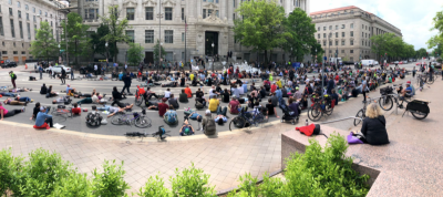 Angry cyclists spilled into the streets outside of City Hall Friday in D.C. following the death of a prominent cycling advocate. Photo: Alex Block