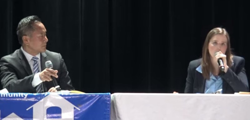 John Lee and Lorraine Lundquist at a recent candidates debate - via YouTube