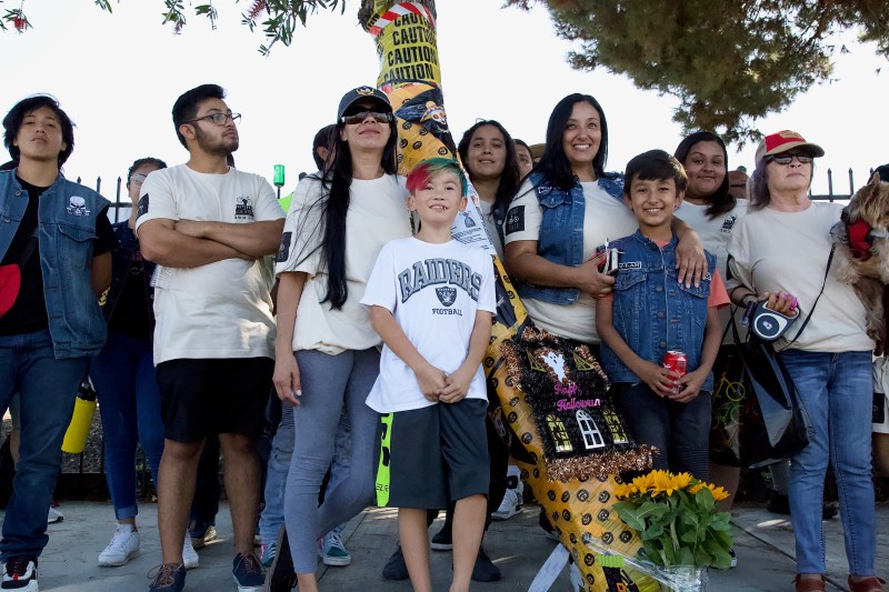 Family members of Benjamín Torres and their supporters gather at the spot where Torres was killed in a hit-and-run in Gardena in 2012. His widow, María, stands at far right. Sahra Sulaiman/Streetsblog L.A.