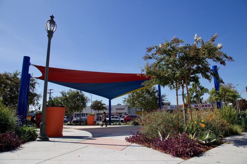 Hoover Triangle 3.0. After the underwhelming debut of Hoover Triangle 2.0 last year, the investment in shade structures, mature trees, tall planters, and an abundance of plants are a welcome sight. Sahra Sulaiman/Streetsblog L.A.