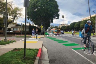 Rendering of proposed Beverly Hills protected bikeway with transit islands - via complete streets report