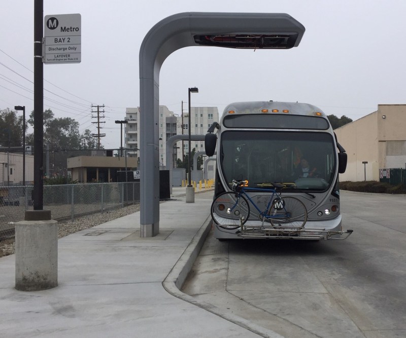 Orange Line bus below North Hollywood station electric charger. Photo by Joe Linton/Streetsblog L.A.