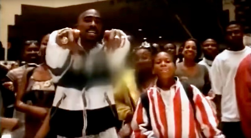 A screengrab of Tupac Shakur performing To Live and Die in L.A. in the Baldwin Hills Crenshaw Mall in 1996. The mall is one of several L.A. landmarks featured in the video.