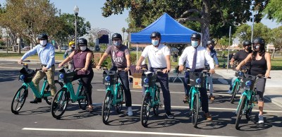 GoSGV, an regional electric assist bike share system, expanded to it's second city in Baldwin Park. From right, Monica Garcia, Baldwin Park city councilmember, BP Mayor Manuel Lozano,  La Verne Mayor Tim Hepburn, BP Mayor Pro Tem Paul Hernandez, Veronica Lopez, representative for assembly member Blanca Rubio, and Bryan Urias,
Senior Field Deputy for LA County Supervisor Hilda Solis. Image: San Gabriel Valley Council of Governments