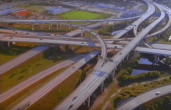 Still from Divided Highways, showing the glory and destructive nature of highway mania.