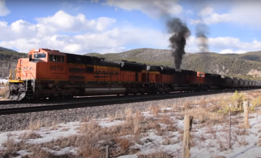 Diesel locomotives spewing smoke. Image capture from the "Railbuffs" Youtube channel.