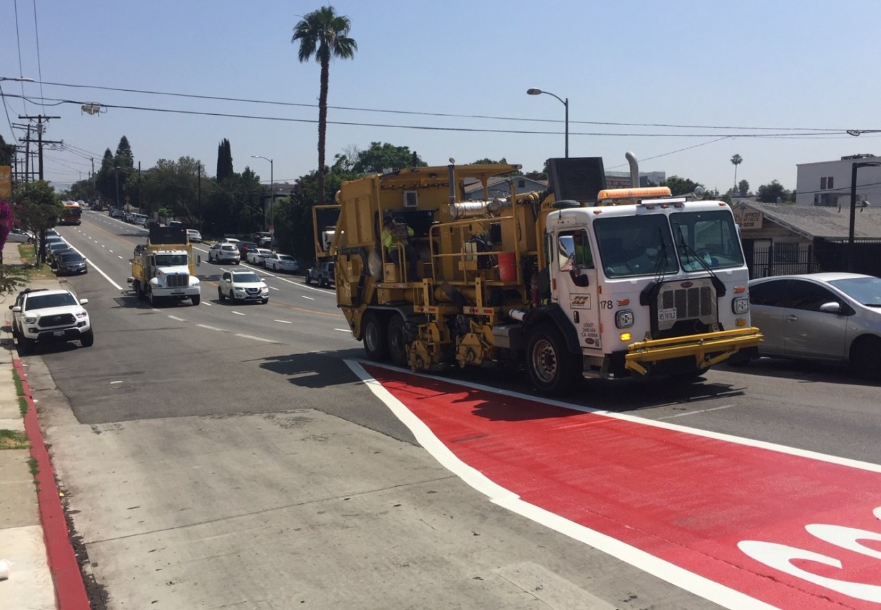 Contractor truck scraping existing pavement markings this morning
