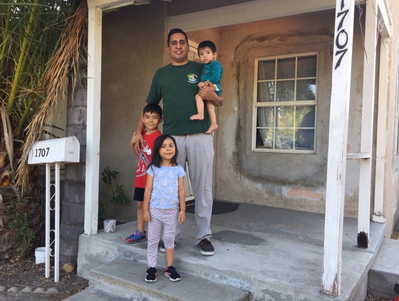 Pomona resident Eric Duran and his children - in front of the home that Caltrans is pushing to evict them from - in order to widen SR-71. See story link below. Photo by Joe Linton/Streetsblog L.A.