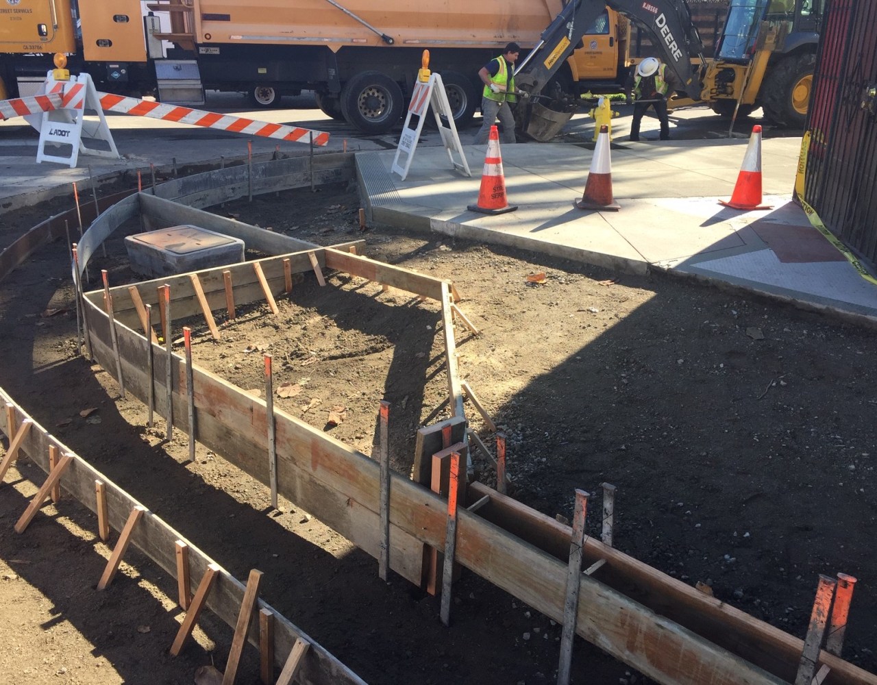 LADOT crews doing sidewalk reconstruction on Adams Boulevard last week