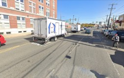 A cyclist rides in an unprotected door-zone bike lane on Washington Avenue. Photo: Google