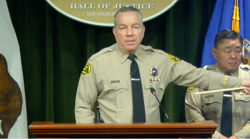 Sheriff Alex Villanueva points at a slide on his power point presentation during a press conference Wednesday, April 13.