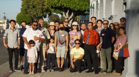 Community members, activists, and one Monterey Park City Council official pose in front of Divine's Furniture after a walk down Garvey Avenue to discuss traffic lane expansion. Credit: Chris Greenspon/Streetsblog